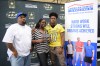 Stephen Carr presents his Dream Champion award to parents Stephen Sr. and Shonnda (Photo: Army All-American Bowl)