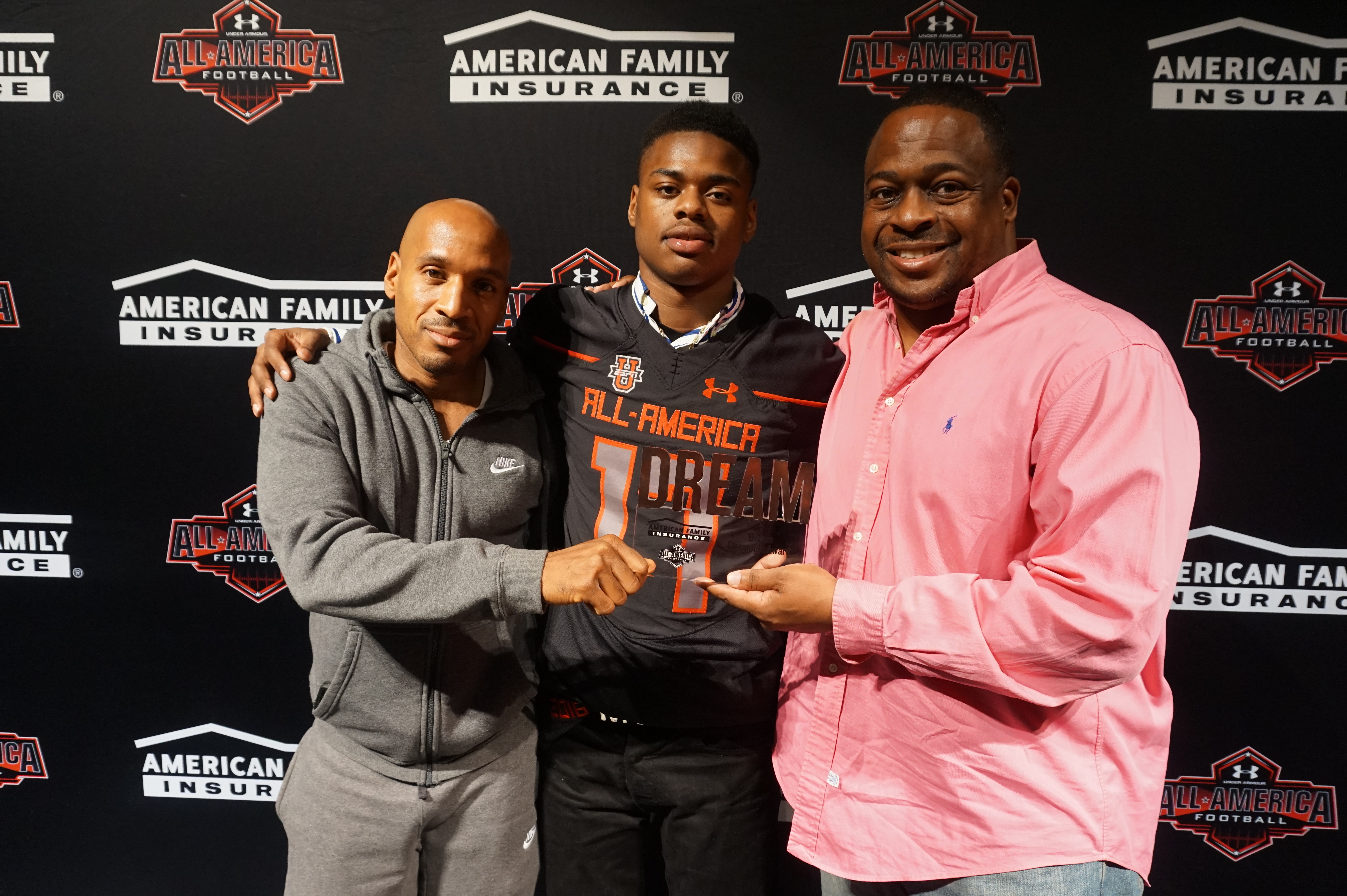 Paris Ford presented his trainers, DeWayne Brown and Sean L. McCaskill, with the Dream Champion Award. (Photo: Intersport)
