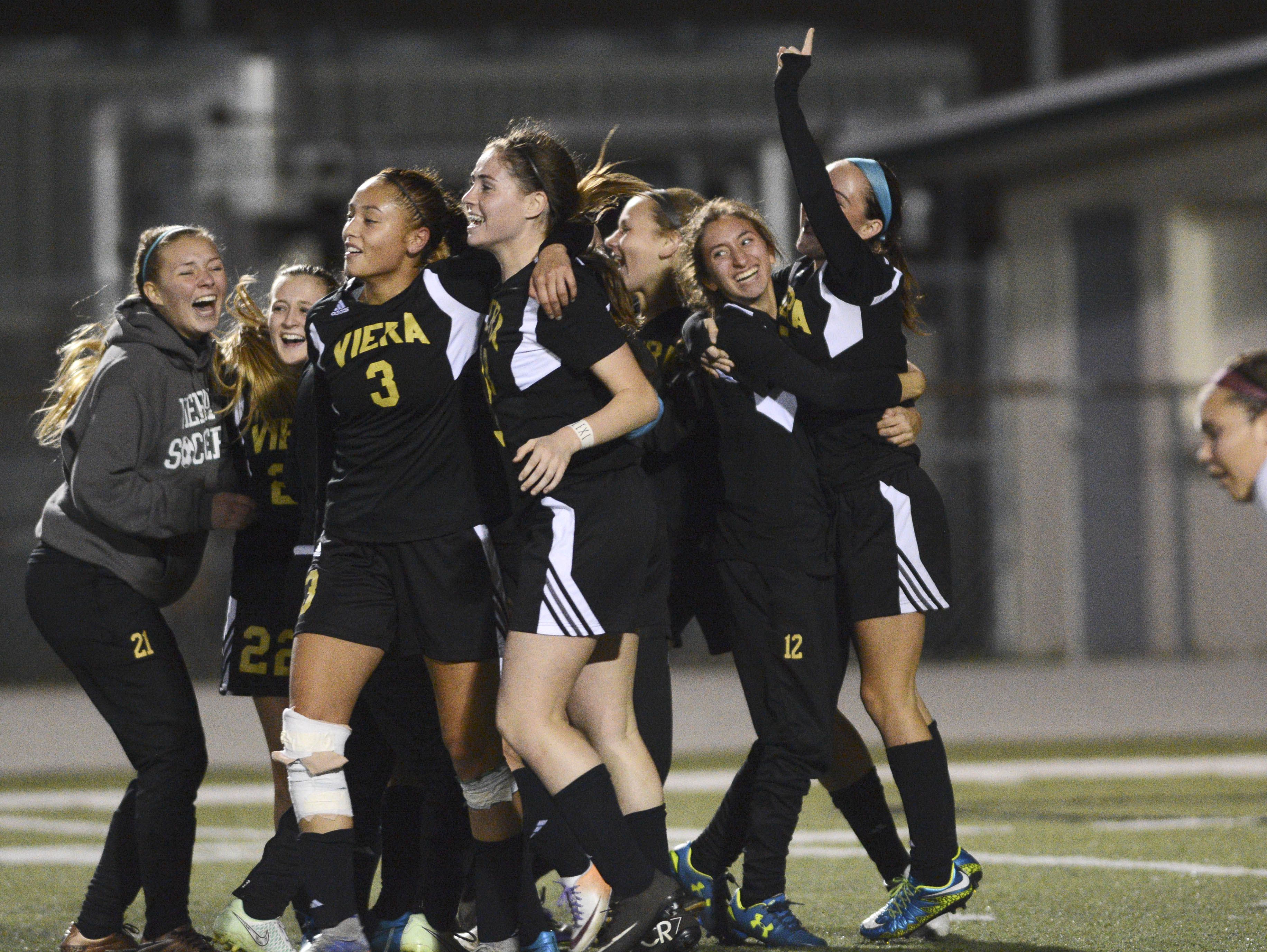 Viera players celebrate their win during Friday's Class 4A state soccer final.