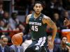 In this Dec. 19, 2015, file photo, Michigan State's Denzel Valentine brings the ball upcourt during the first half of an NCAA college basketball game against Northeastern in Boston.