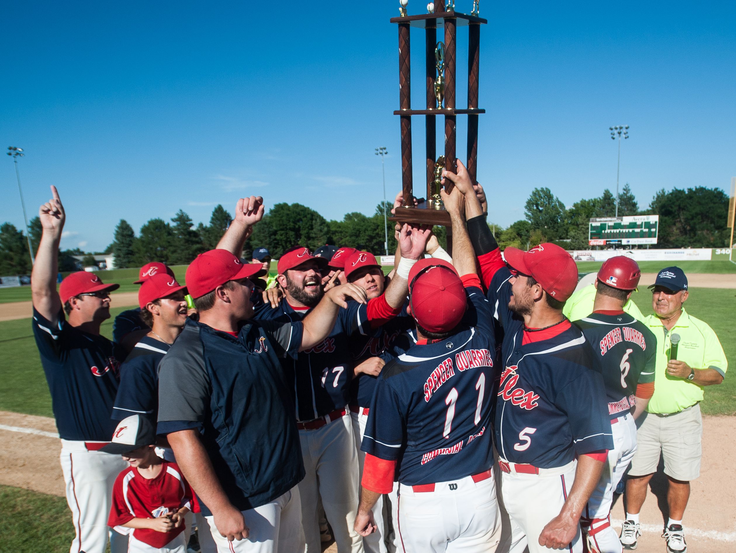 Team members of the Alexandria Angels hold the trophy at the South Dakota Class B Amateur Baseball Championship at Caldwell Park, Mitchell, S.D. The Alexndria Angels wins 7 - 1 over the Garretson BlueJays.