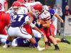 Riverheads' Brett Hostetler runs the football as teammate Chase Armstrong (left) holds off Waynesboro's Phillip Monterrozo during a football game played in Waynesboro on Friday, Sept. 16, 2016.