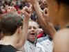 New Albany head basketball coach Jim Shannon joins hands with his team after a time-out. 26 November 2016