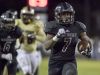 Michael Carter (7) runs for a game tying touchdown during the Navarre vs. Lake Gibson high school state semifinals football game at Navarre High School on Dec. 2.