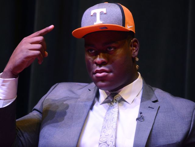 University School of Jackson senior Trey Smith points to a University of Tennessee cap after choosing the school to commit to, Tuesday afternoon.