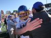 Blacksburg quarterback Grant Johnston gets a hug from his dad, assistant coach Chad Johnston, after winning the 3A state championship over Staunton River.
