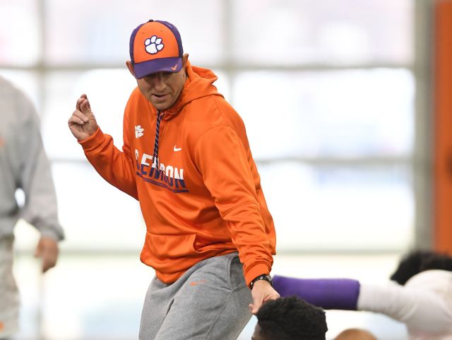 Clemson head coach Dabo Swinney dances while taking with linebacker Judah Davis (36) during the teams practice on Tuesday, December 13, 2016.