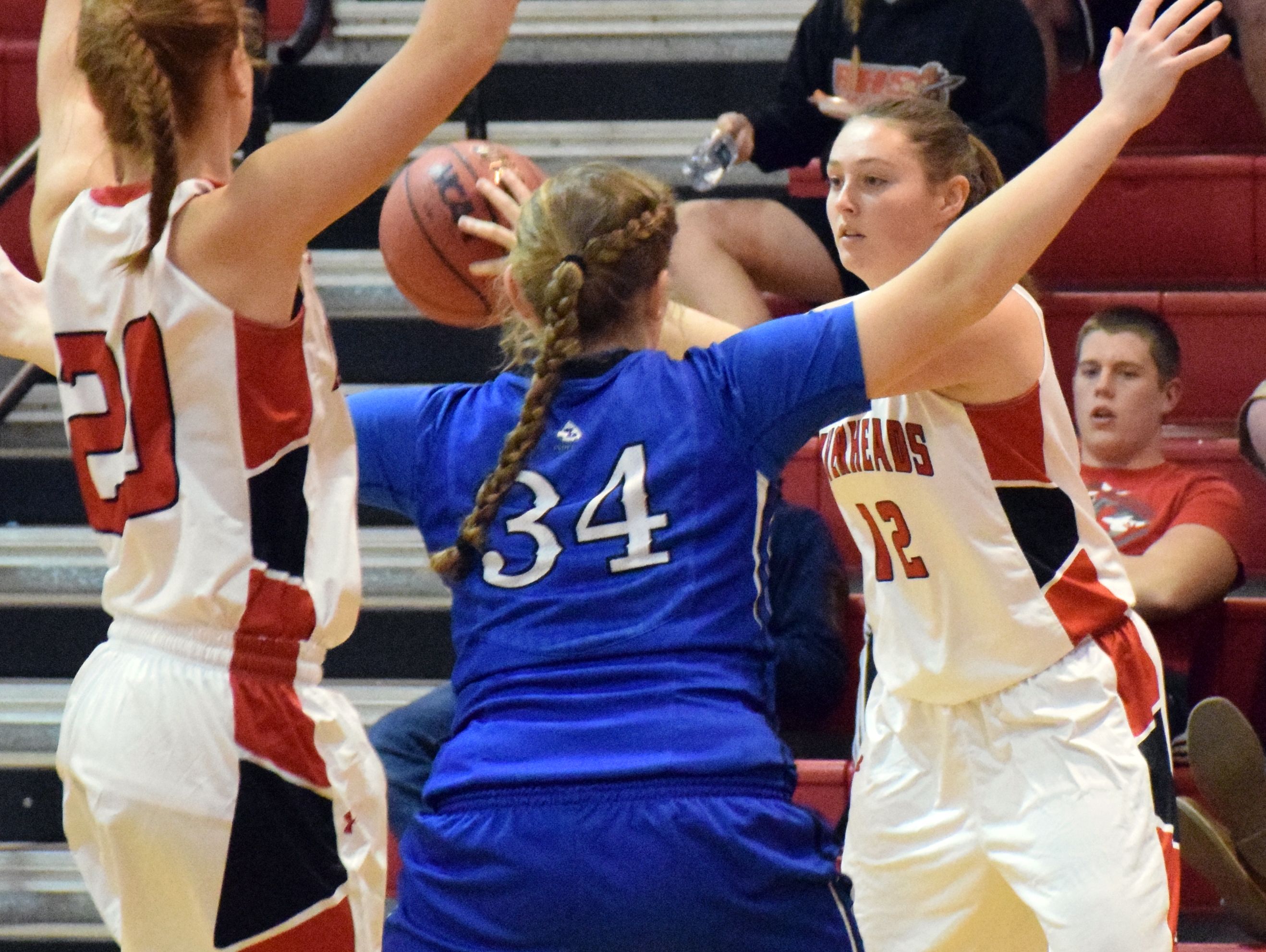 Riverheads' Emma Casto, right, looks for a teammate to pass to as Fort Defiance's Julia Frazier gets between Casto and the Gladiators' Blake Bartley during their girls basketball game Wednesday, Dec. 14, 2016, at Riverheads High School in Greenville, Va.