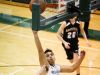 Dansville junior Josh Weldon, left, connects on a reverse layup against Williamston's Frankie Toomey Wednesday, Dec. 21, 2016, at Williamston.