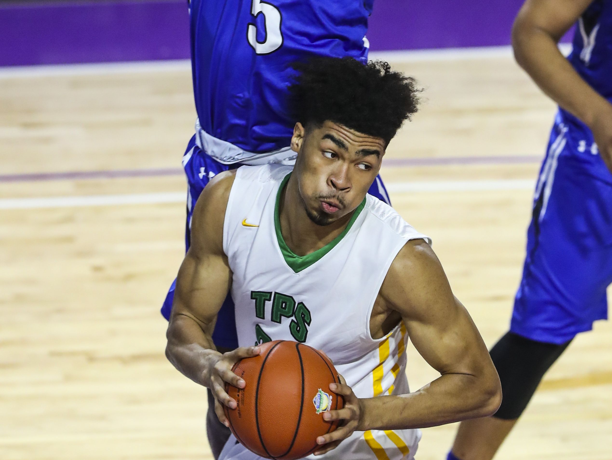The Patrick School's Nick Richards works under the basket as IMG's Emmitt Williams defends. IMG Academy and The Patrick School played Wednesday night in their City of Palms game to determine third place.
