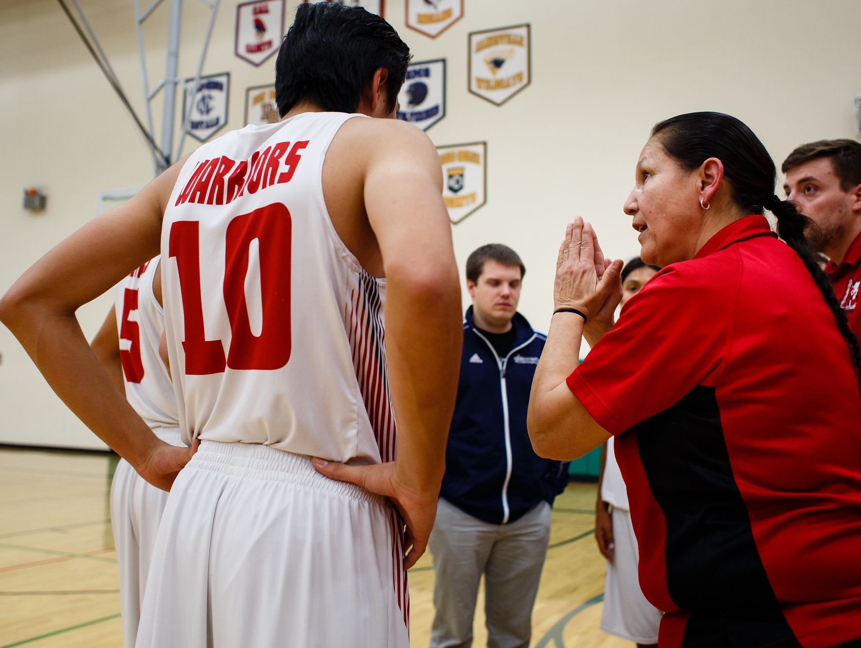 Meskwaki boys' basketball coach Dina Keahna is the only female varsity coach in the state. Her goal she said is to teach the boys life skills through the sport and, "do the the little things and let the score take care of itself." Here she coaches the team during a game at home on Monday, Dec. 19, 2016, in Tama.