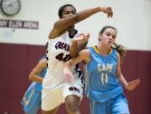 Cape Henlopen guard Carly Truitt (right) makes contact with Wilmington Friends center Jayna Jones who passes the ball off in the first half.