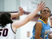 Cape Henlopen guard Dania Cannon (right) drives around Wilmington Friends' Natalie DePaulo and sinks the basket for two.