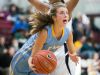 Cape Henlopen guard Alia Marshall dribbles around a defender and scores.