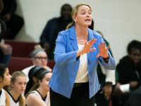 Wilmington Friends coach Carolyn Connors gestures to her players from courtside.