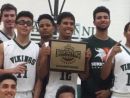 Jaran Whitfield, holding plaque at another tournament, banked in a buzzer-beater 70 footer to beat King in Visit Mesa Challenge