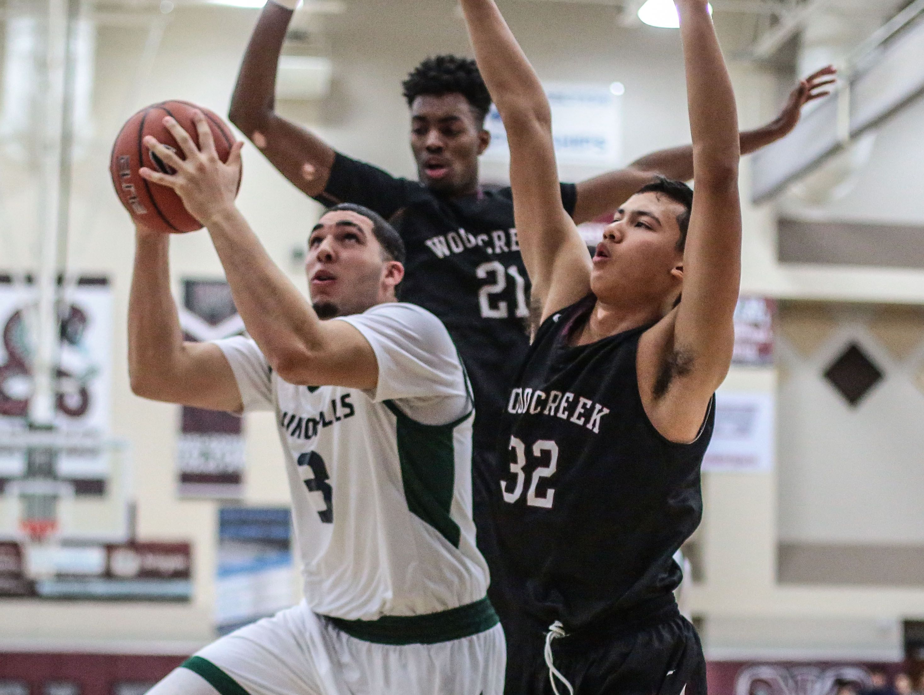 Chino Hills LiAngelo Ball goes for the basket as Woodcreek's Jordan Brown and Chris Cagle try to block him on Wednesday, December 28, 2016 during the Rancho Mirage Holiday Invitational at Rancho Mirage High School.