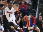 Virginia's Kyle Guy drives past Louisville's Tony Hicks as Guy had nine points in 19 minutes of play in the Cavaliers' win over the Cards 61-53 Wednesday night.