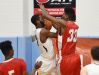 Smyrna's Azubuike Nwankwo (33) blocks a Sanford player's shot .