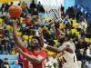 Smyrna's Jaymeir Garnett (5) makes a basket over Sanford's Marcus McCollum.
