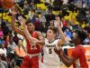 Sanford's Ryan McKeon (5) makes a play for the ball against two Smyrna defenders.
