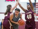 St. Elizabeth senior, Lexi Bromwell (left), and teammate Alexis Lee pressures Monsignor Scanlan guard, Kateri Poole, who tries to squeeze through the two defenders.