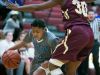 Monsignor Scanlan guard, Channel Williams, tries to dribble around St. Elizabeth defender, Alanna Speaks in the first half.