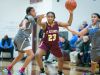 St. Elizabeth forward, Dymond Collins, gets the ball stripped away from her by Monsignor Scanlan guard, Channel Williams (left).