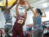 St. Elizabeth forward, Dymond Collins (center), gets blocked by two Monsignor Scanlan defenders, Kayla Morris (left) and Kaylen Banwareesingh.