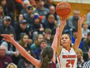 Washington's Jada Cunningham (24) takes a shot over Crofton's Kelsey Sanger (32) during a rescheduled Edith Sanford Breast Center Girls Pentagon Classic game Thursday, Dec. 29, 2016, at Washington High School in Sioux Falls.