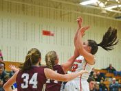 Washington's Peyton Rymerson (32) takes a shot over Crofton's Monica Arens (24) during a rescheduled Edith Sanford Breast Center Girls Pentagon Classic game Thursday, Dec. 29, 2016, at Washington High School in Sioux Falls.