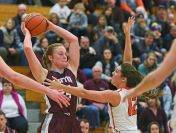 Crofton's Monica Arens (24) works to keep the ball from Washington's Kelsi Kearney (12) during a rescheduled Edith Sanford Breast Center Girls Pentagon Classic game Thursday, Dec. 29, 2016, at Washington High School in Sioux Falls.