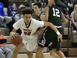 Fern Creek’s Chance Moore (22) fights through the defense of South Oldham’s Peyton Hicks (12) and Devin Young (1) during the second half of the Mitchell Irvin Tournament, Thursday, Dec. 29, 2016 in Crestwood KY.