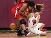 Ursuline's Olivia Mason (right) fights for a loose ball with Roland Park's Christyn Robinson (left) in the first half of Ursuline Academy's 47-40 win over Roland Park Country School in the Diamond State Classic at St. Elizabeth High School in Wilmington on Friday evening.