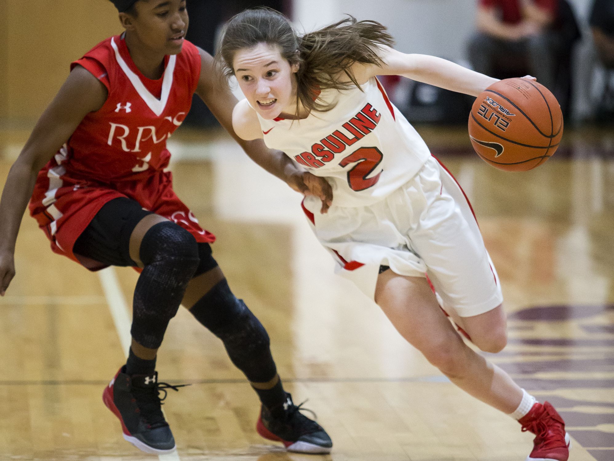 Ursuline's Maggie Connolly drives to the basket in the second half of Ursuline Academy's 47-40 win over Roland Park Country School in the Diamond State Classic at St. Elizabeth High School in Wilmington on Friday evening.