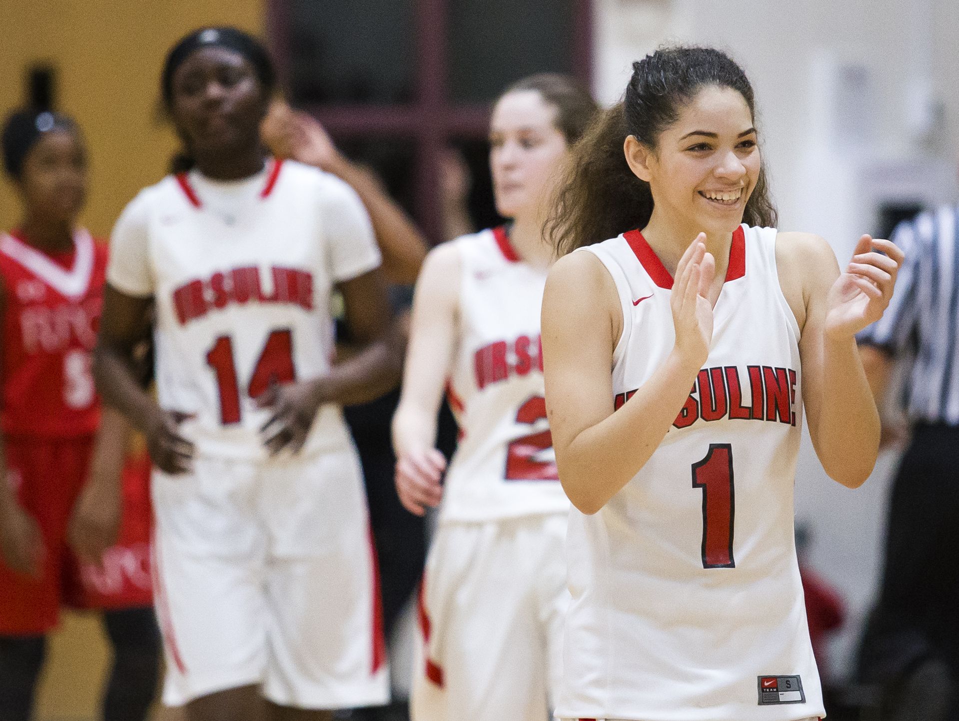 Ursuline's Alisha Lewis celebrates following Ursuline Academy's 47-40 win over Roland Park Country School in the Diamond State Classic at St. Elizabeth High School in Wilmington on Friday evening.