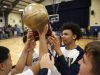 Beacon players hoist the trophy after defeating Spackenkill 76-64 in the championship game of the Duane Davis memorial basketball tournament at Our Lady of Lourdes High School in Poughkeepsie on Saturday, December 31, 2016.