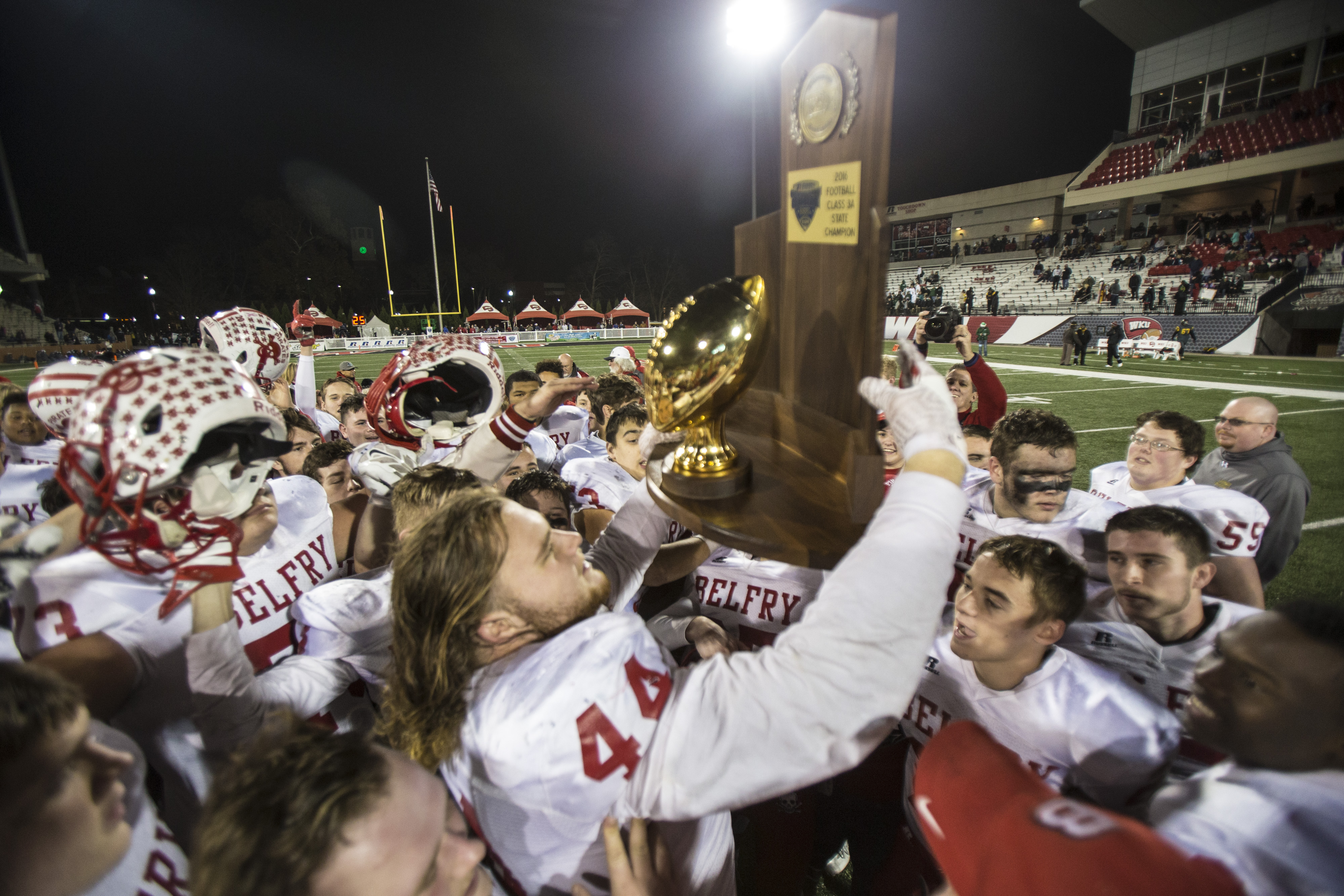 Belfry football players celebrate after a 52-31 victory over Louisville's Central High School to claim the Class 3A State Championship. Dec. 3, 2016