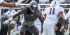 K'Lavon Chaisson pursues Kellen Mond at the Under Armour All-America Game (Photo: 247Sports)