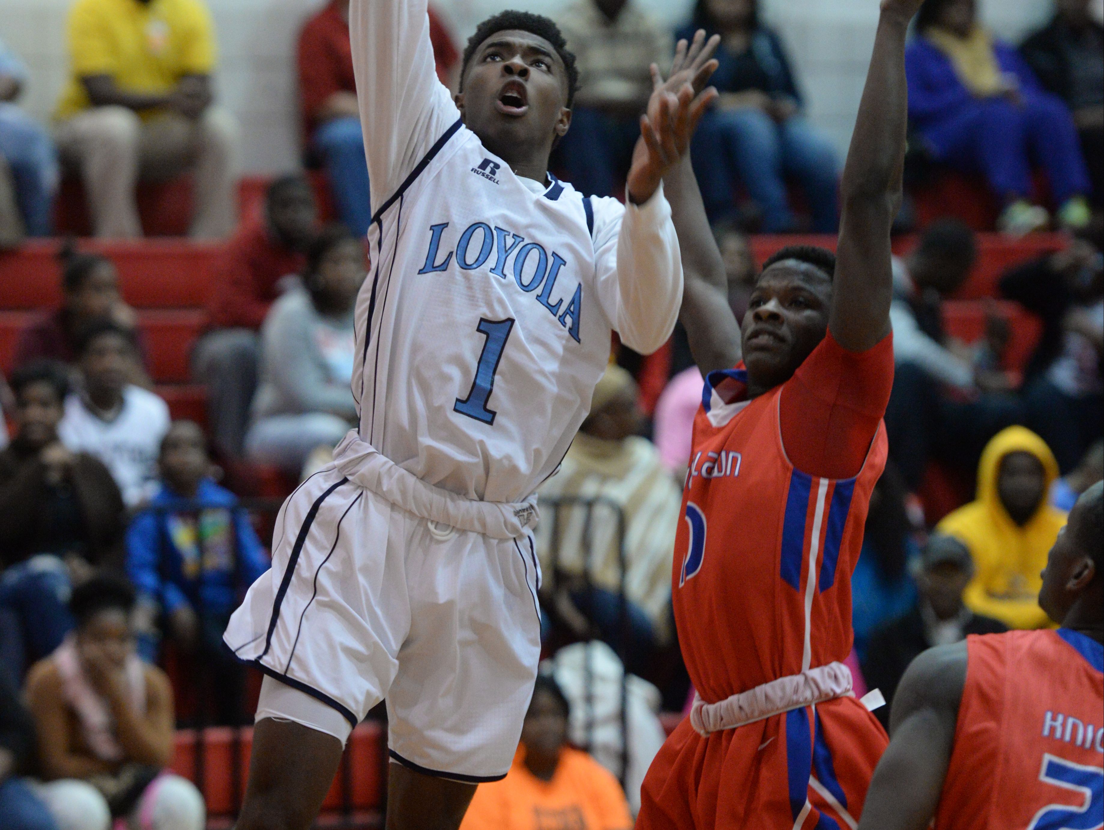 Tony Dorsey of Loyola shoots for two points.