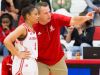 Jeffersonville head coach Mike Warren shares a teaching moment with Jasmine Lilly (5) during a game against Floyd Central at Jeffersonville.