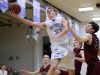 Green Bay Southwest sophomore Will Pytleski (33) puts up a layup against De Pere's Patrick Denan (32) in a Fox River Classic Conference boys basketball game on Dec. 9, 2016. Pytleski is averaging 23.3 points per game to lead the Trojans this season.