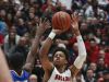 New Albany’s Romeo Langford (1) shoots against Carmel’s Jalen Whack (15) during their game at New Albany High School. New Albany edged Carmel 55-52. Dec. 20, 2016