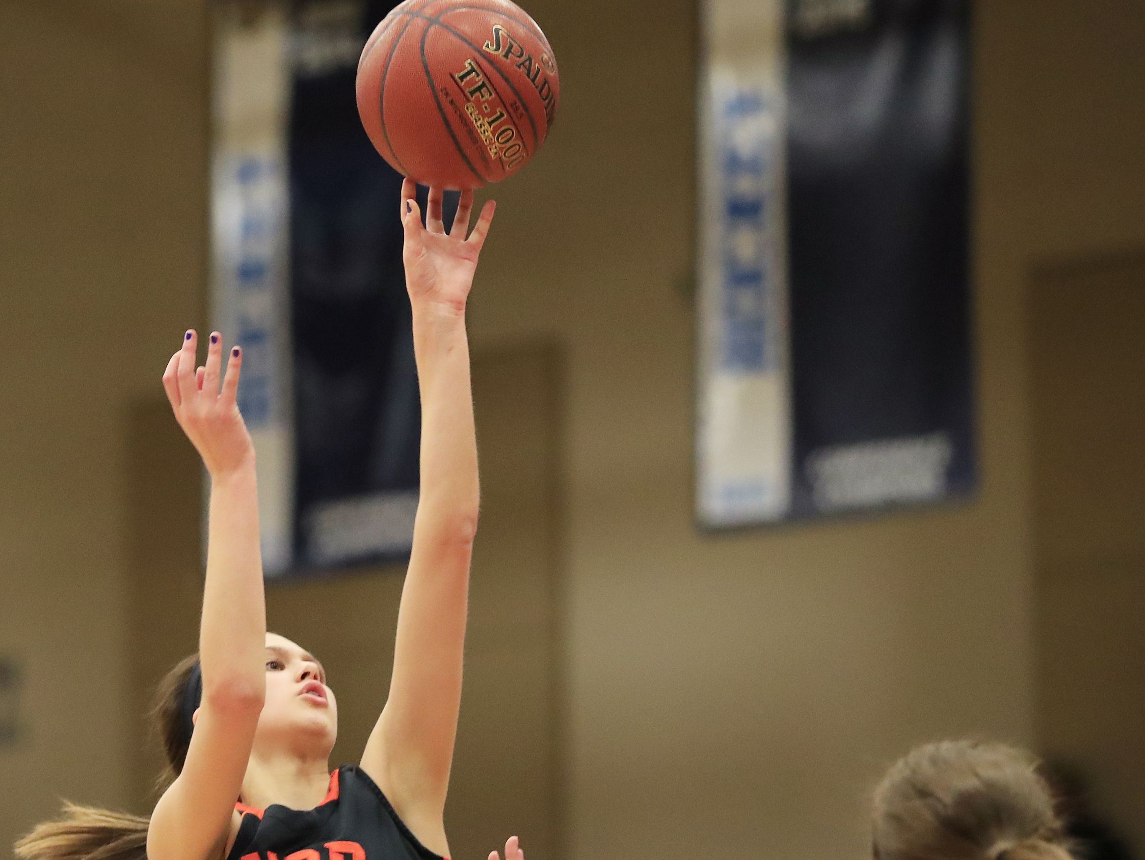 West De Pere's Sam Carriveau (2) shoots over Bay Port defenders during a nonconference girls basketball game Friday in Suamico. The Phantoms picked up the win to improve to 9-0 this season.