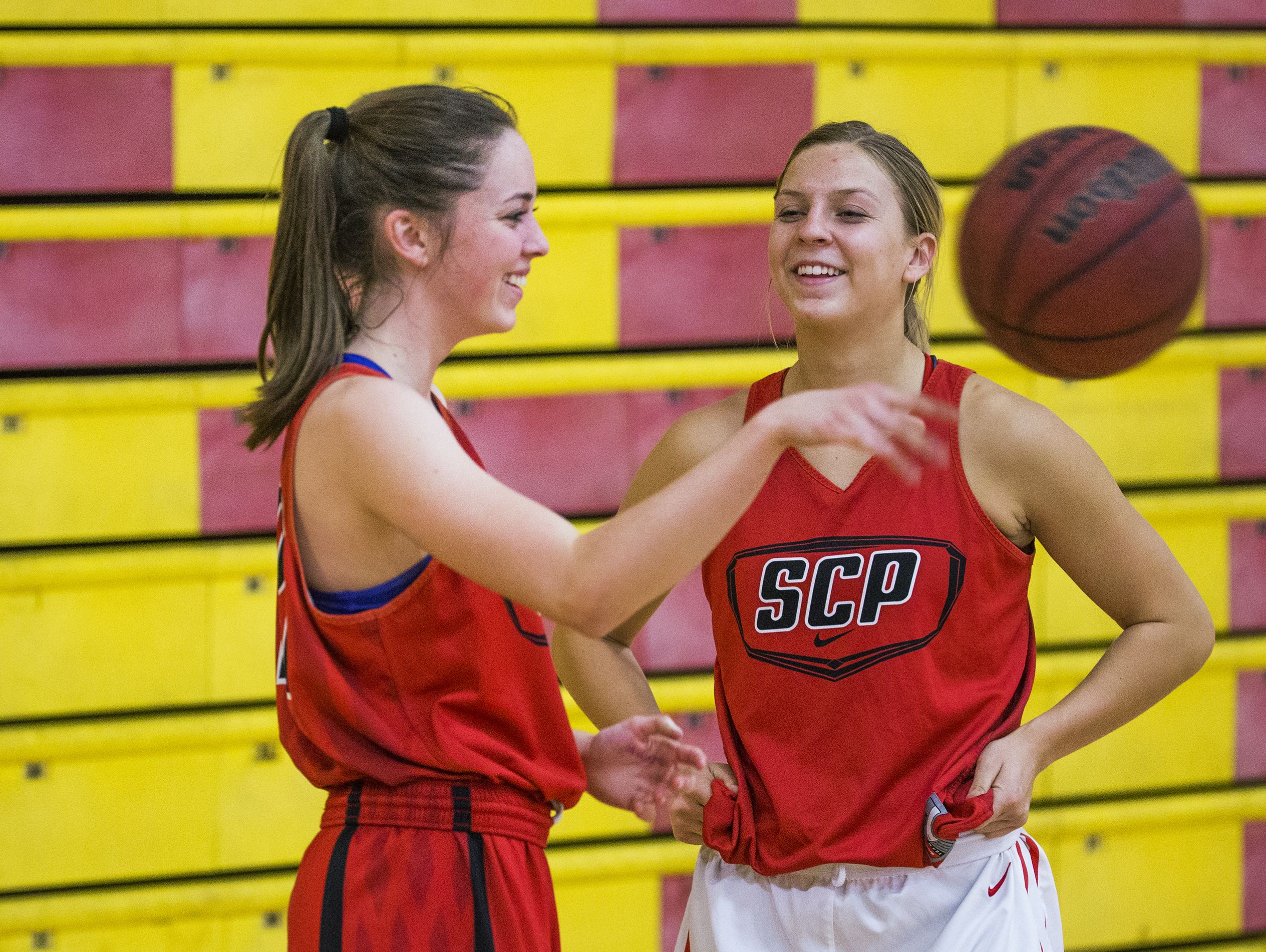 Sarah Barcello, left, and Liz Holter, of the Seton Catholic High School girls basketball team, practice with the team, November 14, 2016.