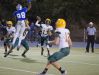 Bishop Manogue quarterback Connor Noland passes over McQueen's Ricky Thomas Jr. in 2014.