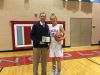 Anna Brecht poses with head coach Matt Daly after breaking Sioux Falls Lincoln's career scoring record on Tues., Jan. 10, 2017 against Yankton.