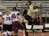 Basha's Terrell Brown hurdles over Desert Mountain's Kaiden Paulson during their high school football game Thursday, Sept. 15, 2016 in Chandler, Ariz.