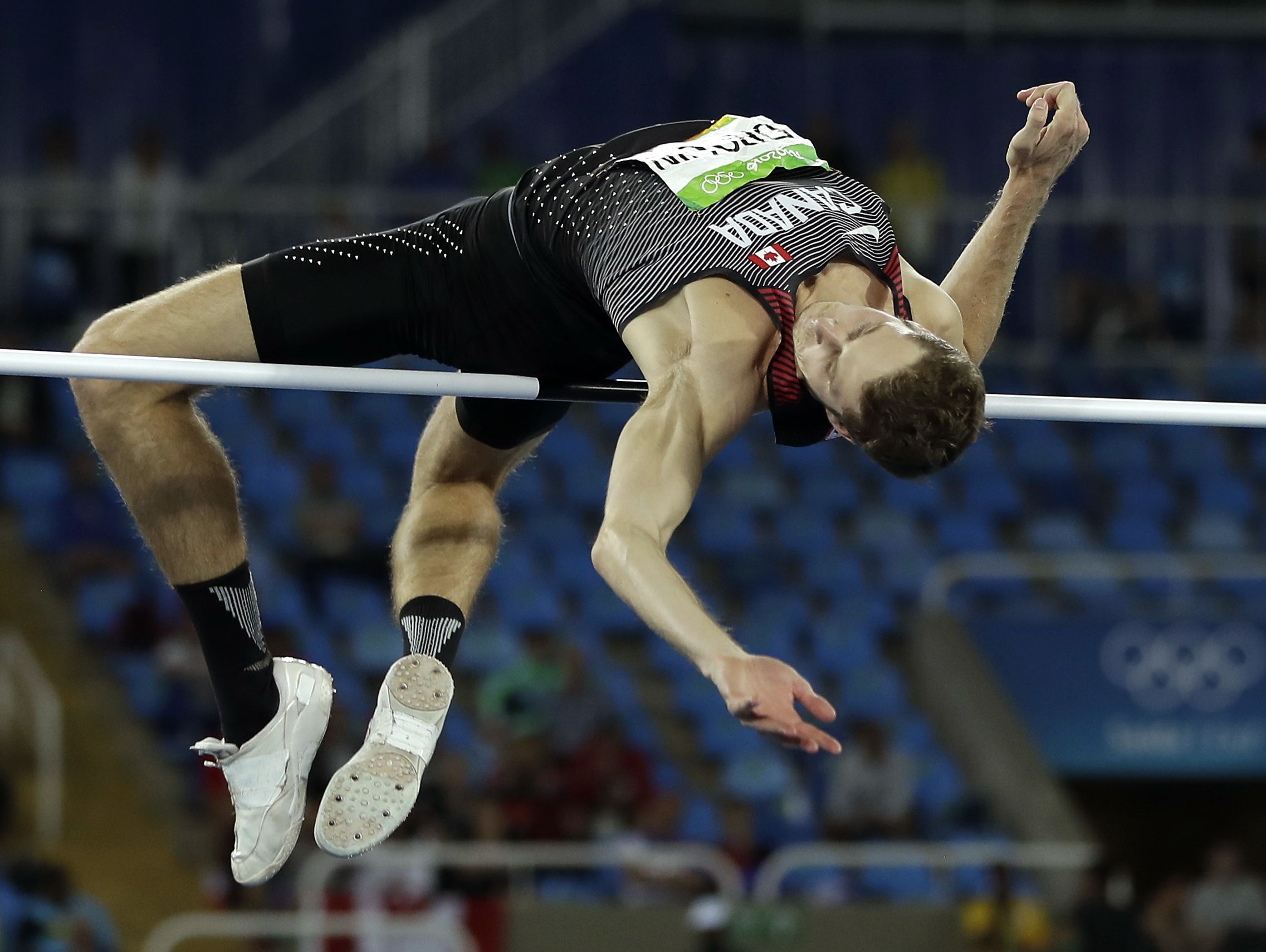Canada's gold medal winner Derek Drouin competes in the men's high jump final, during the athletics competitions in the Olympic stadium of the 2016 Summer Olympics in Rio de Janeiro, Aug. 16, 2016.