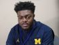 Flint Southwestern football player Deron Irving Bey talks about heading to play football at University of Michigan next season on Friday January 20, 2017 at Flint Carman-Ainsworth High School.
